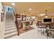 Finished basement with bar seating, full kitchen, and ample room for entertaining at 12671 Home Farm Ln, Westminster, CO 80234