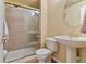Bathroom featuring a glass-enclosed shower, white toilet, and pedestal sink at 12671 Home Farm Ln, Westminster, CO 80234