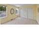 Bright bedroom featuring carpet floors, large windows, and closet storage at 12671 Home Farm Ln, Westminster, CO 80234