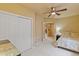 Bedroom with french doors, large closet, ceiling fan, and neutral carpet at 12671 Home Farm Ln, Westminster, CO 80234