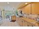 Updated kitchen boasting granite countertops, custom cabinets, stainless steel appliances, and a breakfast nook area at 12671 Home Farm Ln, Westminster, CO 80234