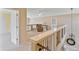 Open loft area with comfortable seating, natural light, and decorative lighting fixtures at 12671 Home Farm Ln, Westminster, CO 80234