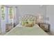 Bright bedroom features windows, elegant furniture, and a green-toned color scheme at 12671 Home Farm Ln, Westminster, CO 80234