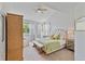 Comfortable bedroom features a vaulted ceiling, an upholstered headboard, and neutral decor at 12671 Home Farm Ln, Westminster, CO 80234