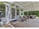 Covered outdoor patio with seating and space for entertaining guests at 12671 Home Farm Ln, Westminster, CO 80234