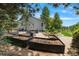 Backyard garden area featuring multiple raised garden beds and gravel paths at 12671 Home Farm Ln, Westminster, CO 80234