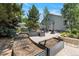 Backyard garden area featuring multiple raised garden beds and gravel paths at 12671 Home Farm Ln, Westminster, CO 80234