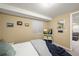 Cozy bedroom featuring natural light and neutral paint scheme at 7927 Elmwood St, Littleton, CO 80125