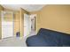 Bedroom with large closet, neutral carpet, and a dark futon at 7927 Elmwood St, Littleton, CO 80125