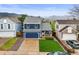 Charming two-story home with a well-manicured lawn and mountain views at 7927 Elmwood St, Littleton, CO 80125