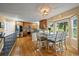 Charming kitchen and dining area with stainless steel appliances and light-filled windows at 7927 Elmwood St, Littleton, CO 80125