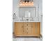 Bathroom features a double vanity with a large mirror and modern fixtures at 3469 Benton St, Wheat Ridge, CO 80212