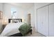 Well-lit bedroom with neutral tones and closet for storage at 3469 Benton St, Wheat Ridge, CO 80212