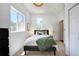 Cozy bedroom with natural light, featuring a closet and neutral decor at 3469 Benton St, Wheat Ridge, CO 80212