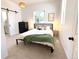 Bright bedroom with a modern design, featuring a sliding barn door and an inviting window view at 3469 Benton St, Wheat Ridge, CO 80212