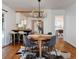 Stylish dining room adjacent to the kitchen, features modern lighting, and seamless flow to the kitchen at 3469 Benton St, Wheat Ridge, CO 80212