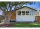 Charming home with fresh exterior paint, large windows and a well manicured lawn at 3469 Benton St, Wheat Ridge, CO 80212
