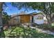 Attractive exterior view of the property showcasing fresh paint, curb appeal and an inviting entry at 3469 Benton St, Wheat Ridge, CO 80212