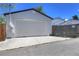 Detached two-car garage with driveway and alley access at 3469 Benton St, Wheat Ridge, CO 80212