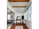 Inviting living room with exposed beams, hardwood floors and natural light at 3469 Benton St, Wheat Ridge, CO 80212
