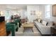Stylish living room showcases hardwood floors, a comfortable sofa, and an open layout perfect for entertaining at 3469 Benton St, Wheat Ridge, CO 80212