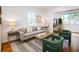 Cozy living room featuring hardwood floors, modern décor, and comfortable seating at 3469 Benton St, Wheat Ridge, CO 80212