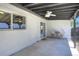 Relaxing covered patio with a ceiling fan and string lights for evening enjoyment at 3469 Benton St, Wheat Ridge, CO 80212