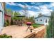 Outdoor deck area with grill, table, chairs, and manicured lawn next to the garage at 3425 W 34Th Ave, Denver, CO 80211