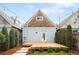 Inviting backyard with a wooden deck, lush greenery, and stepping stone path at 3425 W 34Th Ave, Denver, CO 80211