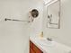 Bright bathroom featuring a vanity with a sink and a large mirror with vanity lights at 1247 Dexter St, Denver, CO 80220