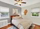 Inviting bedroom featuring neutral tones, ceiling fan, and natural light from windows at 1247 Dexter St, Denver, CO 80220