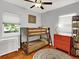 Charming bedroom with a bunk bed, bright dresser, and hardwood floors at 1247 Dexter St, Denver, CO 80220