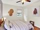 Cozy bedroom with a comfortable bed, ceiling fan, natural light from windows at 1247 Dexter St, Denver, CO 80220