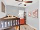 Cozy bedroom featuring a bunk bed, bright dresser, and hardwood floors at 1247 Dexter St, Denver, CO 80220