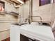 Laundry room featuring new front load washer and dryer units and shelving at 1247 Dexter St, Denver, CO 80220