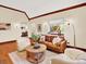 Bright living room showcasing hardwood floors, natural light, and comfortable furniture at 1247 Dexter St, Denver, CO 80220