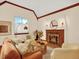 Cozy living room featuring a fireplace, comfortable seating, and natural light at 1247 Dexter St, Denver, CO 80220