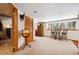 Basement features a globe on a stand, a small table with stools, and views of the outdoors at 266 Lodgepole Dr, Evergreen, CO 80439