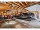 Spacious garage with high ceilings, perfect for car parking and storage, filled with lots of equipment at 266 Lodgepole Dr, Evergreen, CO 80439