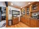 Bright kitchen with wooden cabinets, modern appliances, granite countertops, and a view of the home's interior at 266 Lodgepole Dr, Evergreen, CO 80439