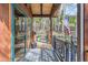 Welcoming porch with wood accents and an American flag, offering a peaceful entrance at 266 Lodgepole Dr, Evergreen, CO 80439