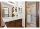 Bathroom with a large mirror, vanity with ample storage, and glass shower stall at 8610 E Eastman Ave, Denver, CO 80231