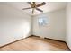 Bright bedroom with hardwood flooring, a window offering natural light, and neutral walls at 8610 E Eastman Ave, Denver, CO 80231