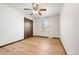 Cozy bedroom with natural light, hardwood floors, and a closet for storage at 8610 E Eastman Ave, Denver, CO 80231