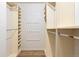 Spacious walk-in closet with custom shelving and rods for optimal organization at 8610 E Eastman Ave, Denver, CO 80231