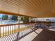 This covered deck has wooden slats and posts at 8610 E Eastman Ave, Denver, CO 80231