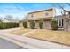 Inviting two-story home featuring brick accents, a well-maintained yard, and an attached two-car garage at 8610 E Eastman Ave, Denver, CO 80231