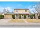 Charming home with a two-car garage, brick facade, trimmed bushes, and a well-manicured front yard at 8610 E Eastman Ave, Denver, CO 80231