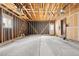 Spacious garage featuring concrete floors, exposed wood framing, and modern garage door openers at 8610 E Eastman Ave, Denver, CO 80231