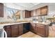 This is the kitchen with granite countertops and dark cabinets at 8610 E Eastman Ave, Denver, CO 80231